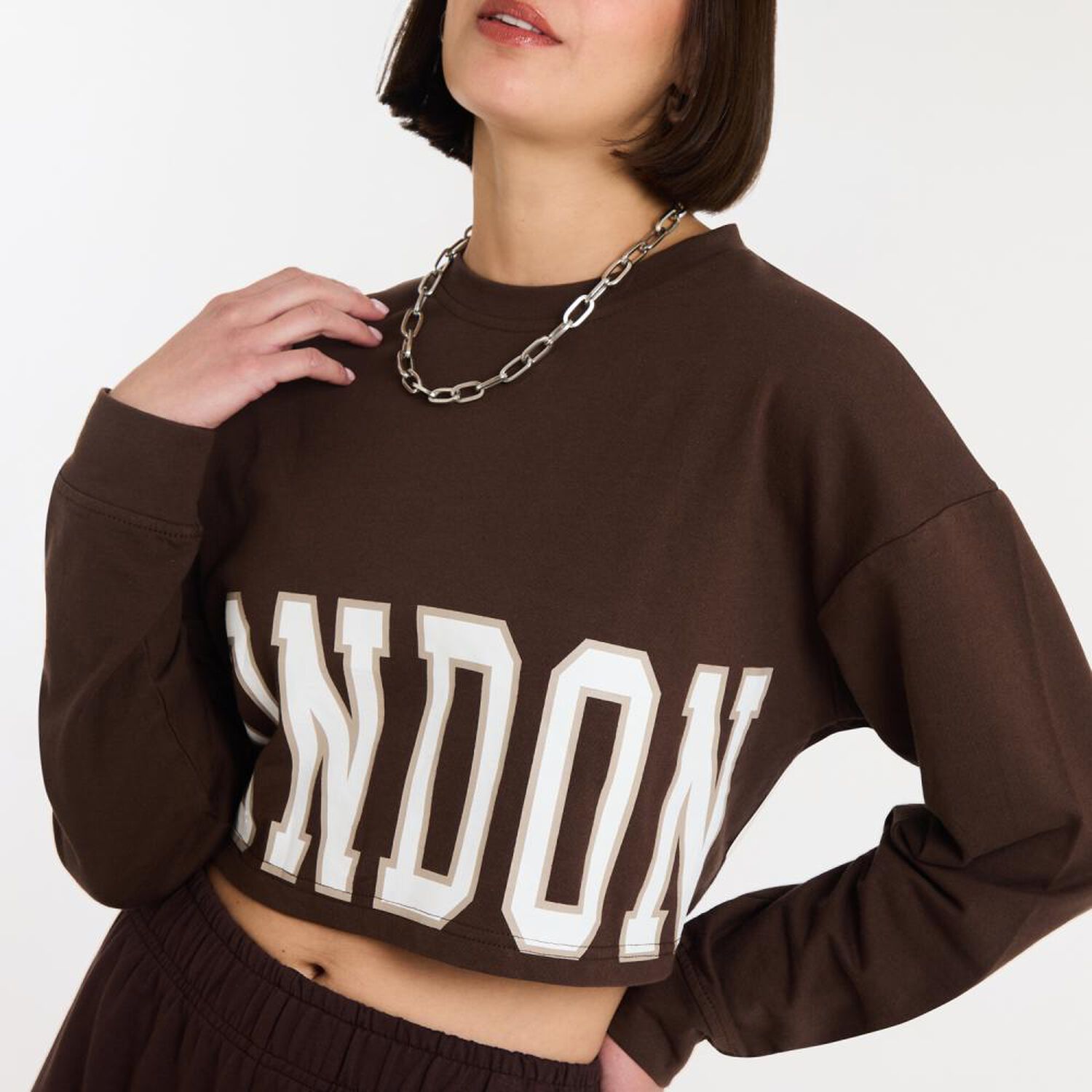 Poler&oacute;n Crop Top Manga Larga Cuello Redondo Mujer Rolly Go image number 4.0