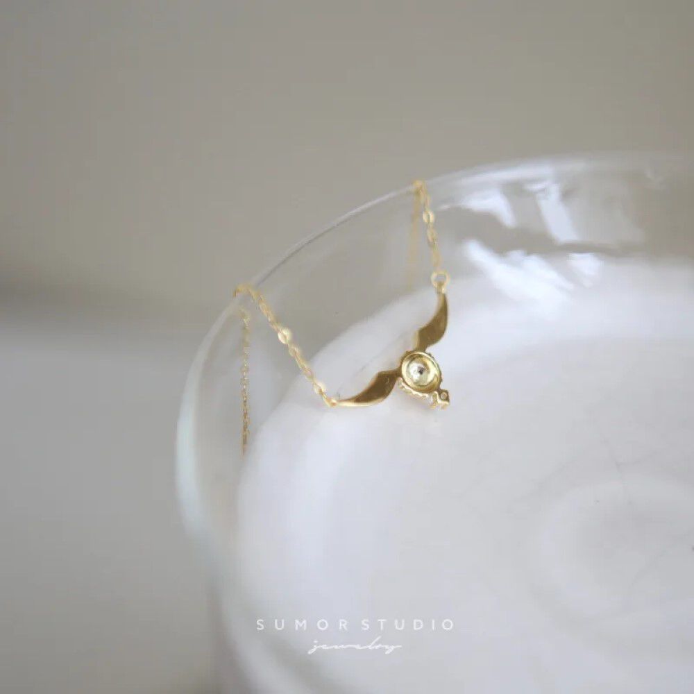 Collar Hogwarts Snitch Dorada Brillante Harry Potter image number 2.0