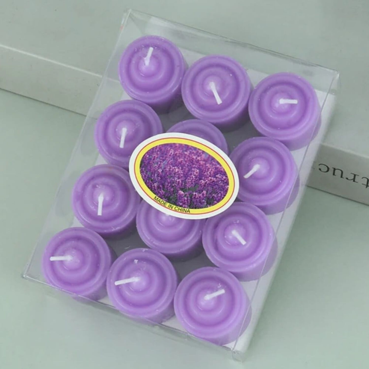 Pack De 12 Velas Moradas Arom&aacute;ticas 3.5x3.5 Cm image number 0.0